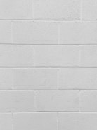 Close-up of a freshly painted white wall with clean edges.