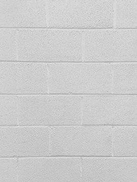 Close-up of a freshly painted white wall with clean edges.