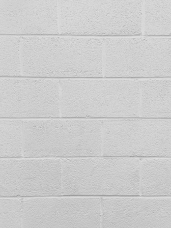 Close-up of freshly painted white wall with smooth finish.