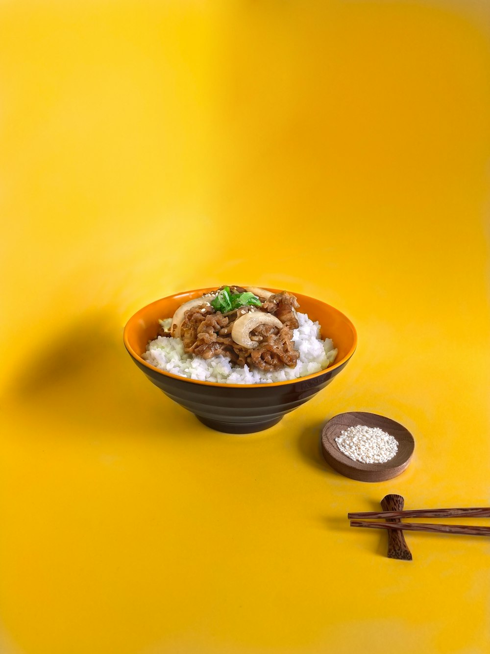 white ceramic bowl with stainless steel spoon