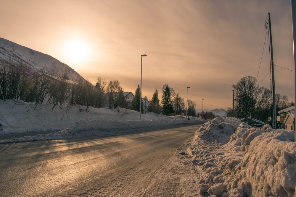 snow covered road during daytime