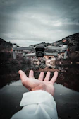 person holding black and white camera