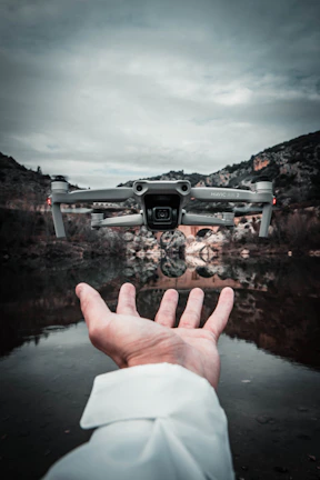 person holding black and white camera
