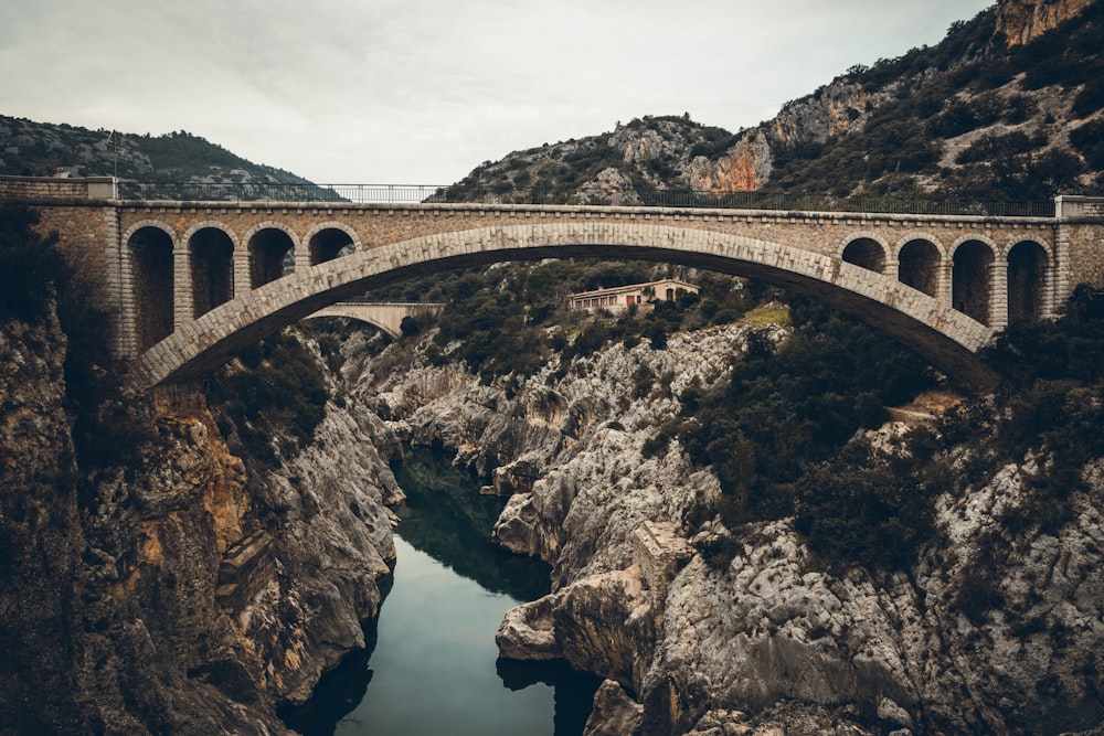 gray concrete bridge over river