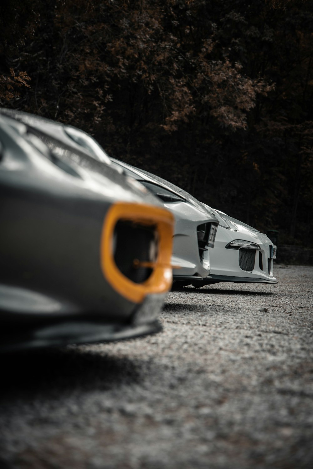 white and orange sports car on road