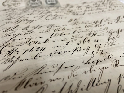 A close-up of aged manuscripts and photographs documenting Mandar's history.