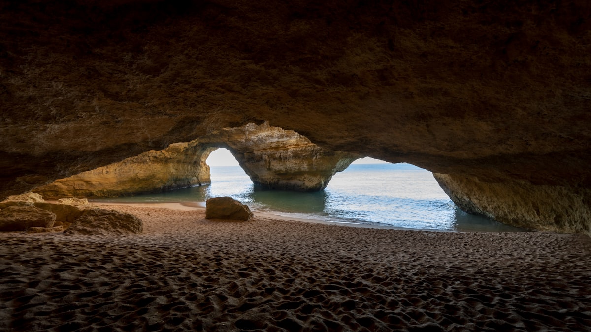 The Eye of Benagil Cave viewed from above showing the famous skylight opening in the Algarve cliffs