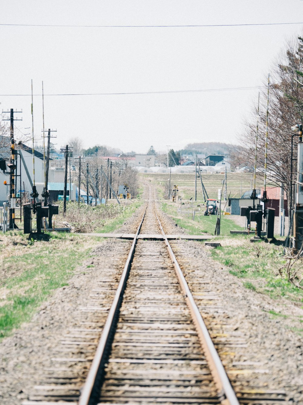 red train on rail tracks