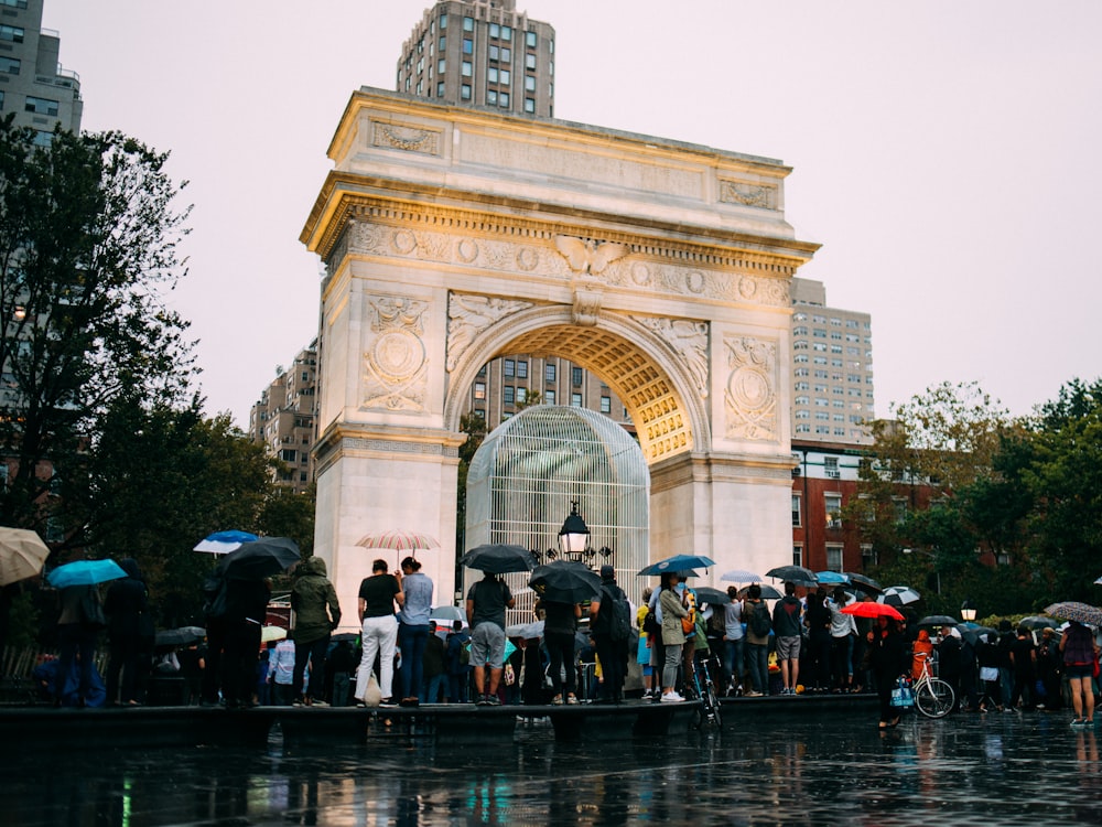 people standing near arc de triomphe during daytime