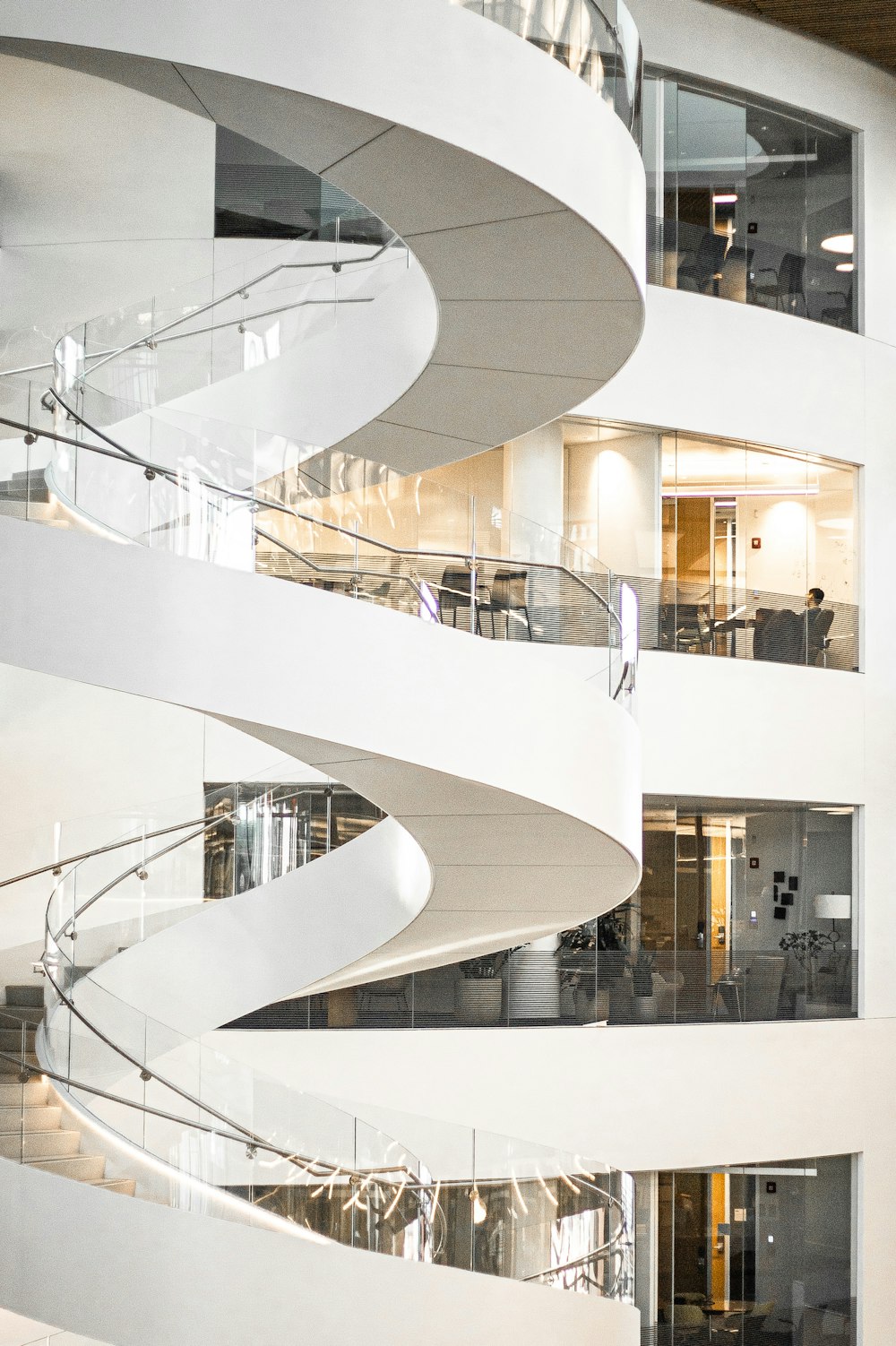 white spiral staircase with glass windows