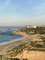 white concrete building near sea during daytime