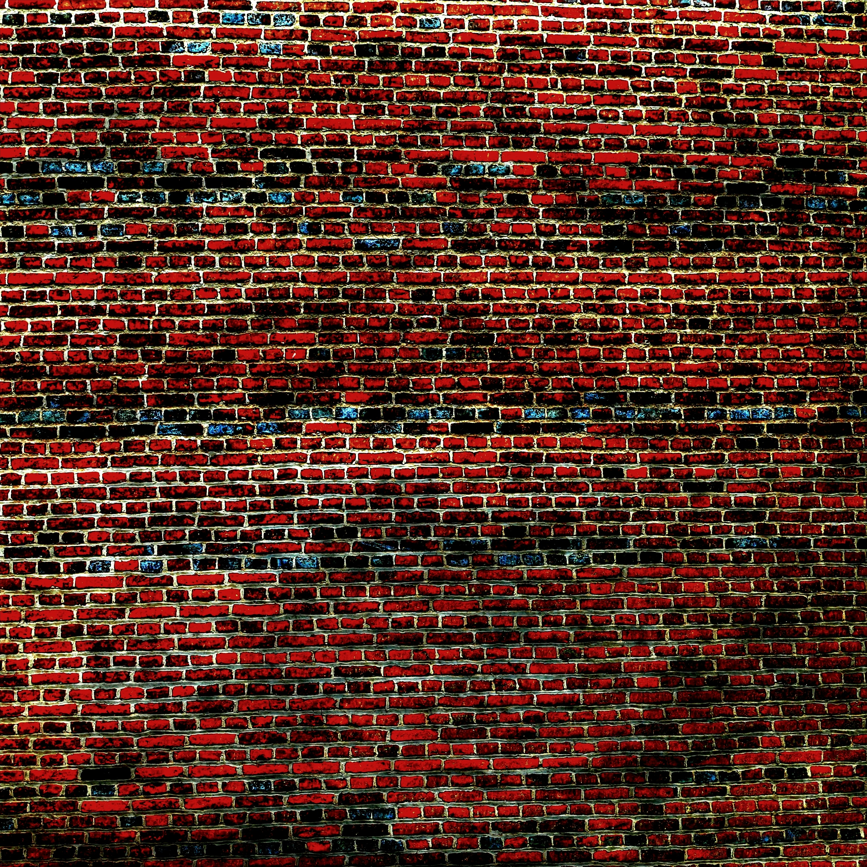 Red brick wall installation, professional masonry, warm tones