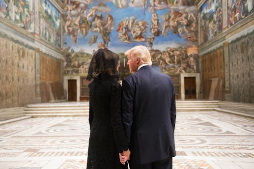 man in black suit standing beside woman in black dress