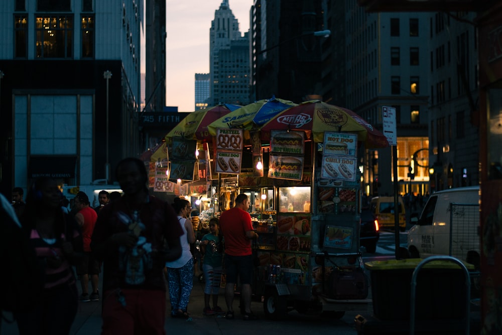 people walking on street during night time