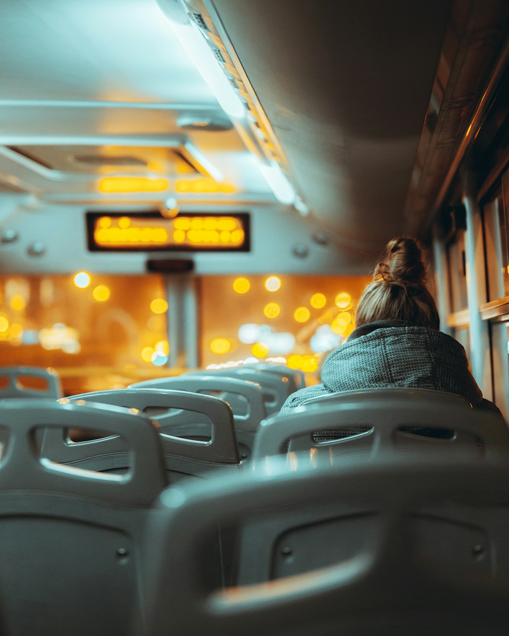 people sitting on gray chair inside train