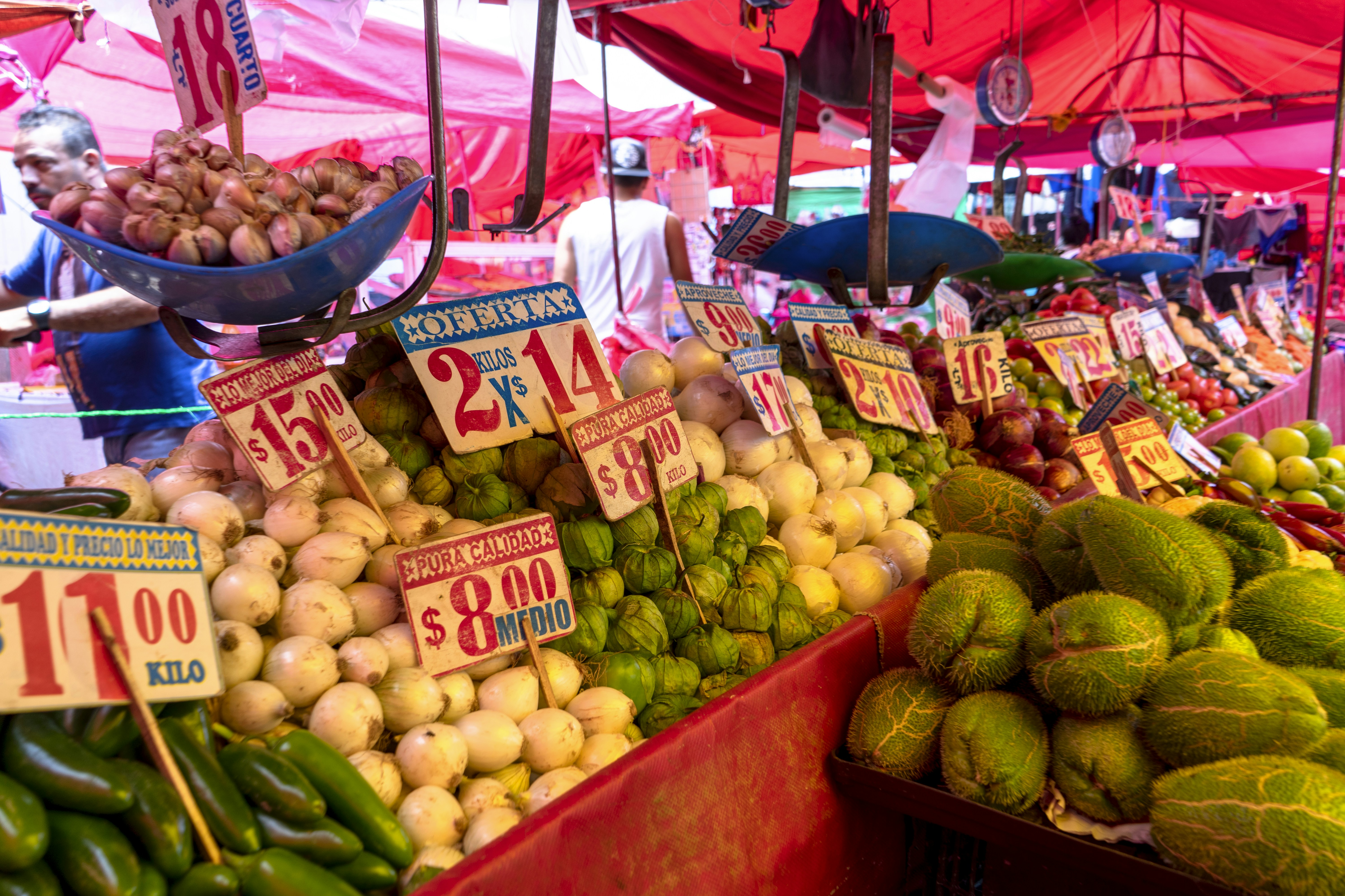 Market vendors and produce stalls in a crowded Global South food market