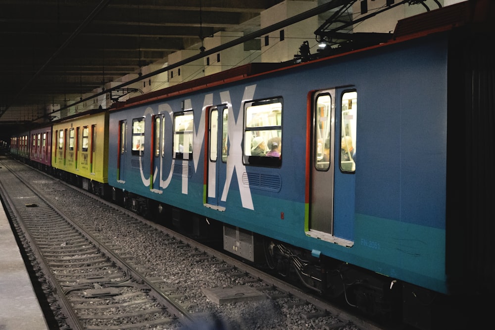 blue and white train on train station