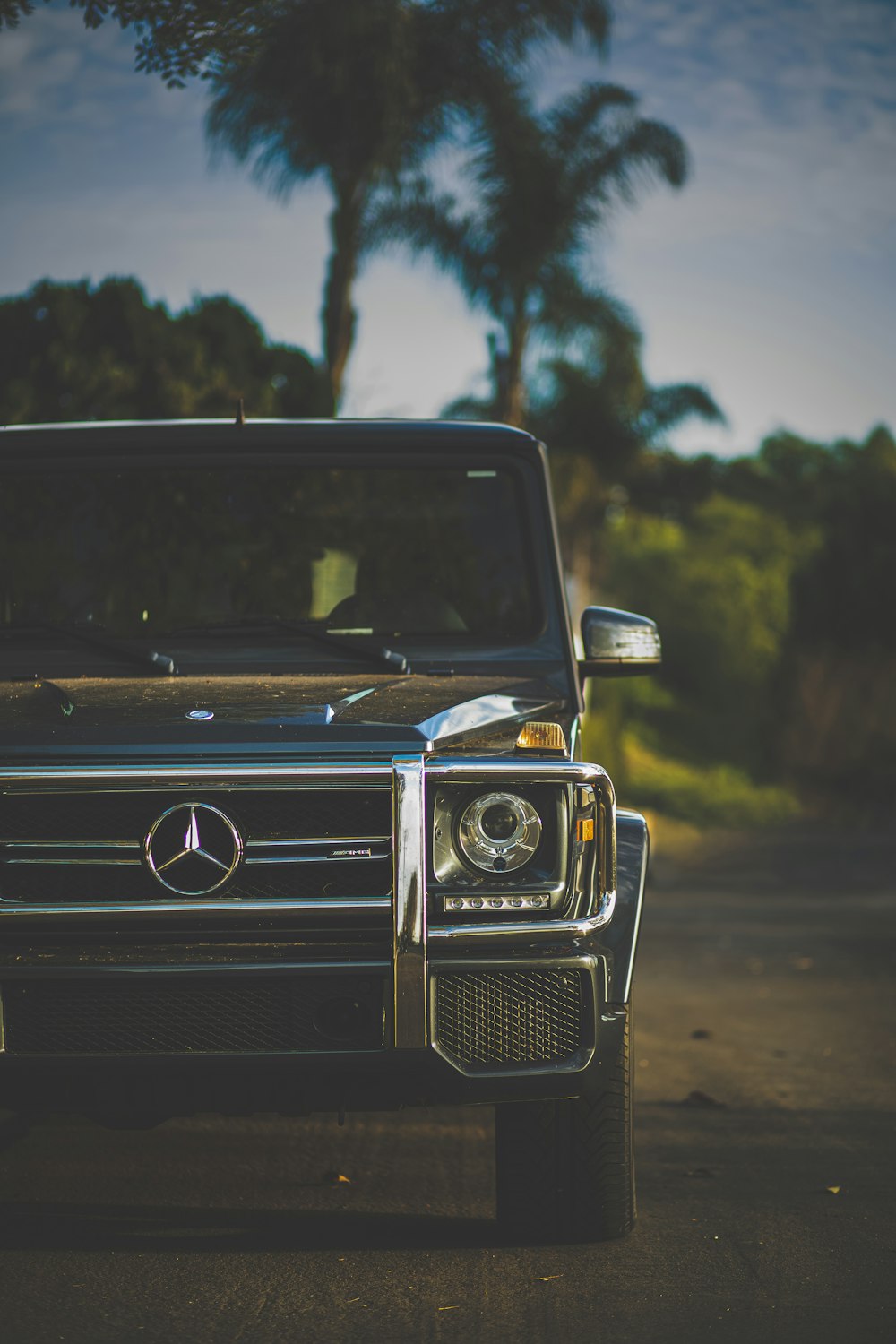 black mercedes benz car on road during daytime