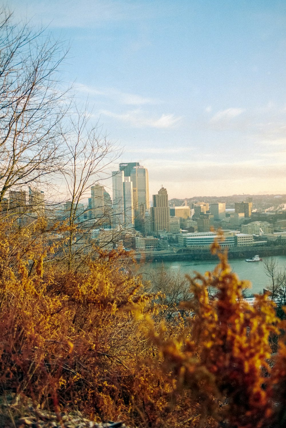 city skyline across body of water during daytime