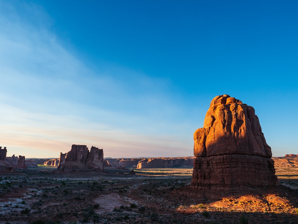 brown rock formation under blue sky during daytime