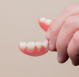 person holding pink plastic hair clip