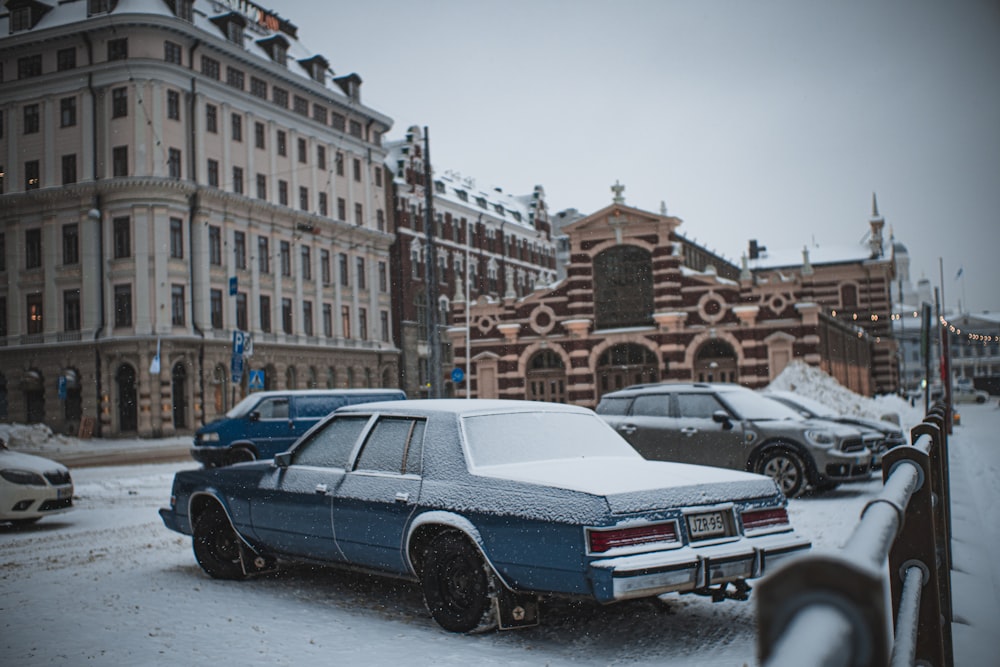 blue and white sedan on road during daytime