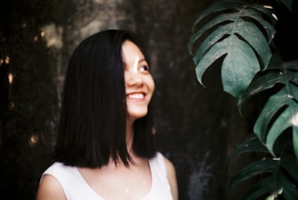 A candid shot of Monica smiling during a mentoring session, surrounded by notes and plants.
