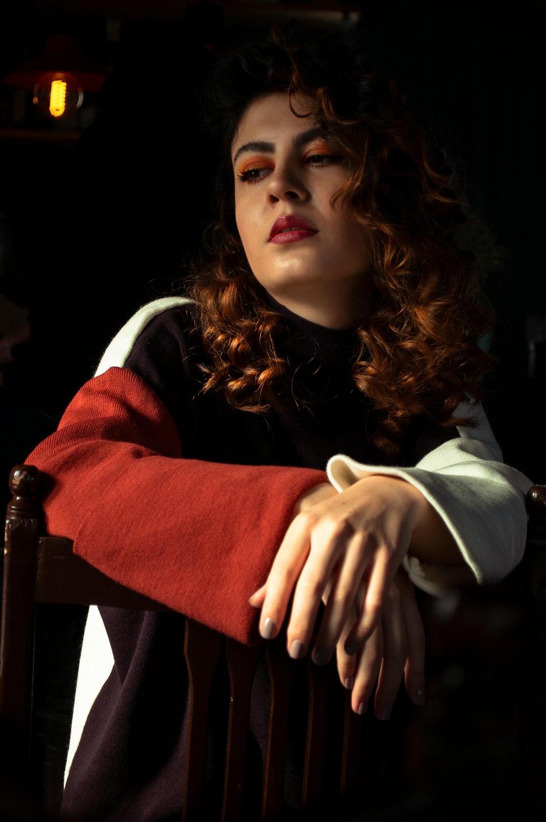 woman in red and white long sleeve shirt