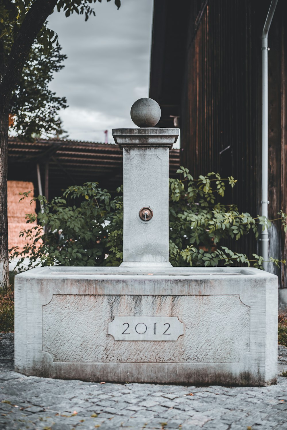 gray concrete tomb with love print