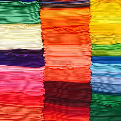 pink green blue and yellow textile