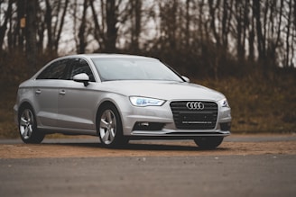 gray audi a 4 coupe on road during daytime
