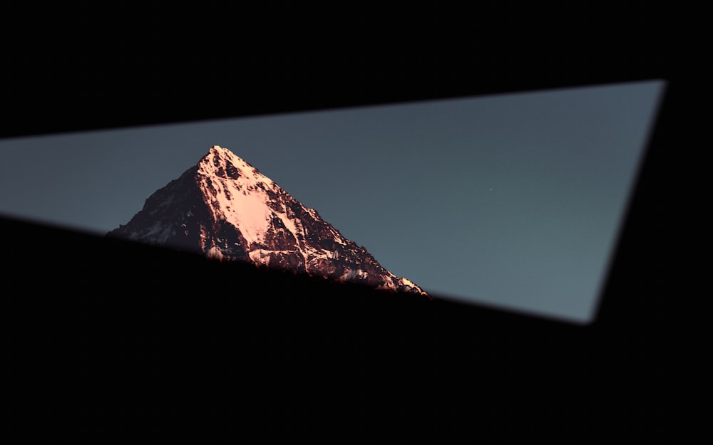 snow covered mountain under blue sky during daytime