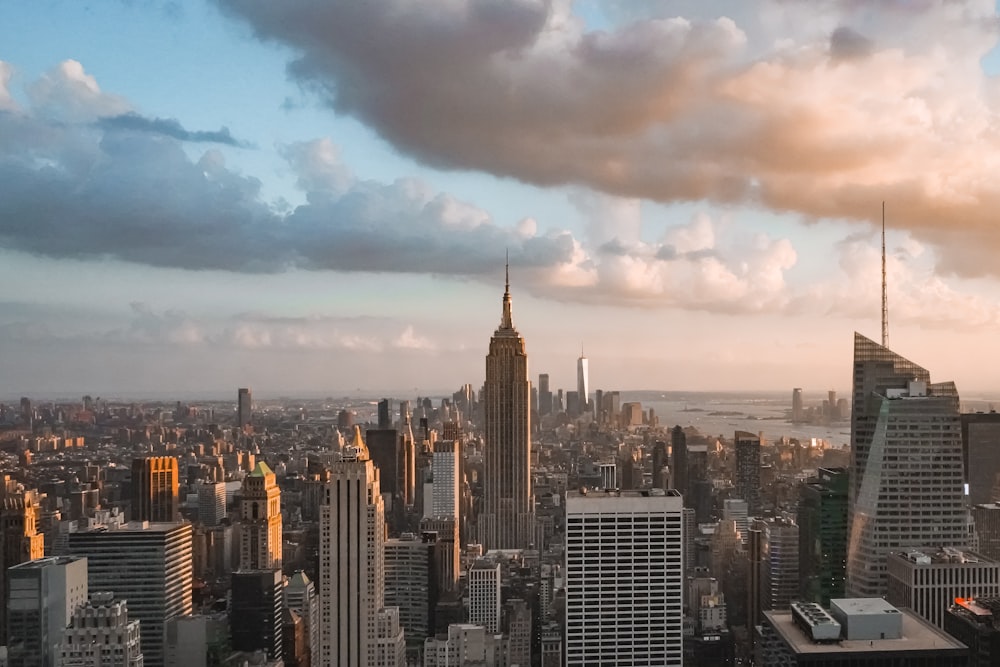 city skyline under cloudy sky during daytime