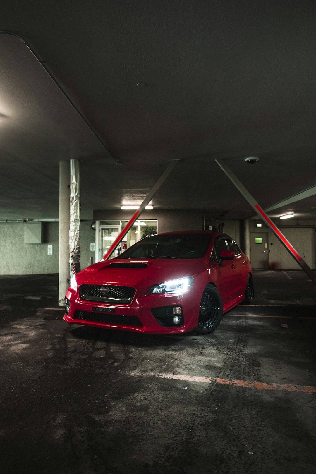 red car parked in garage