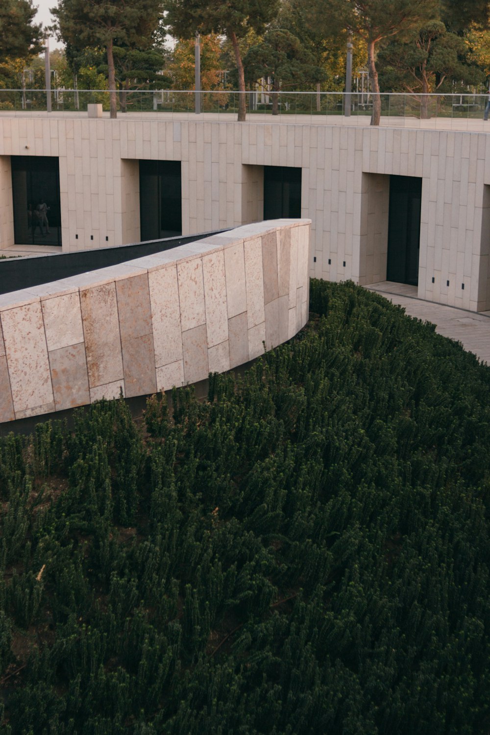 green grass near white concrete building during daytime