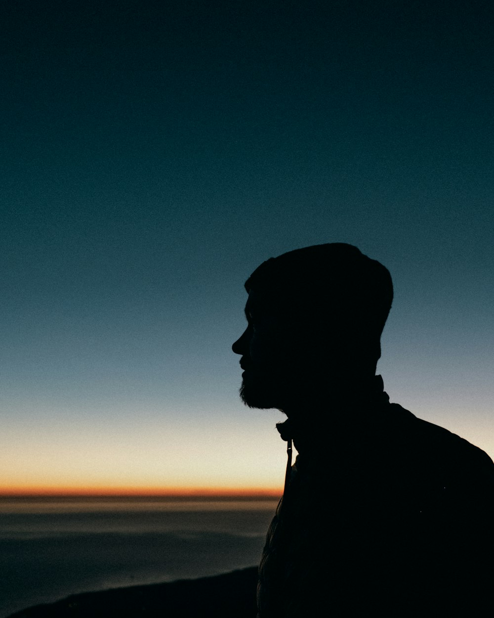 silhouette of man during sunset