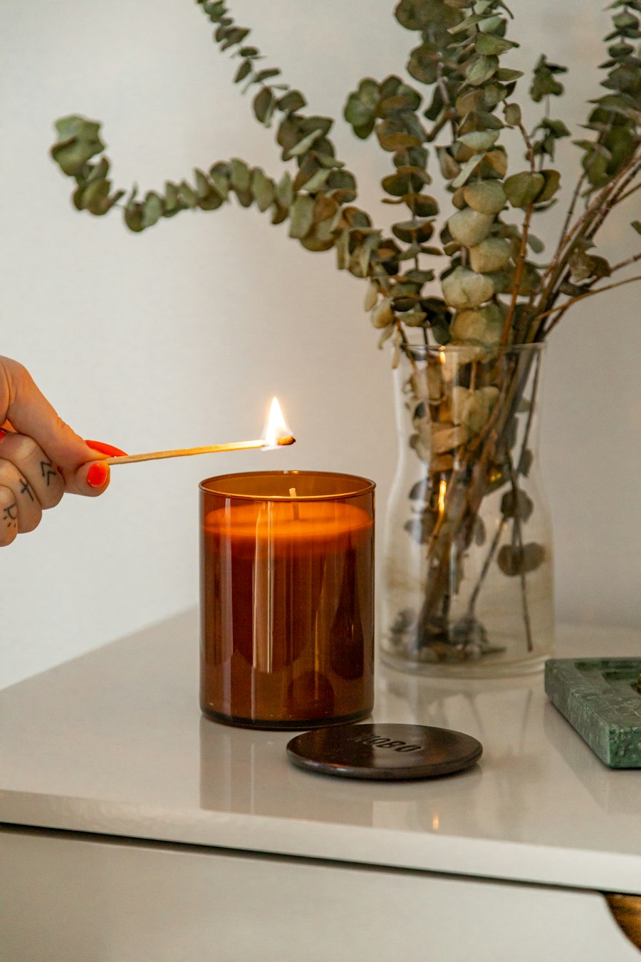 Handpouring a soy candle