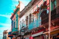 blue and brown concrete building under blue sky during daytime