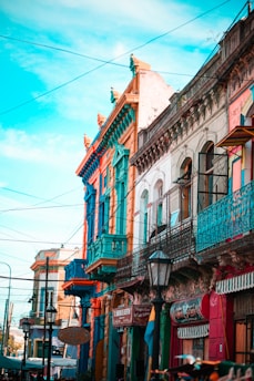 blue and brown concrete building under blue sky during daytime