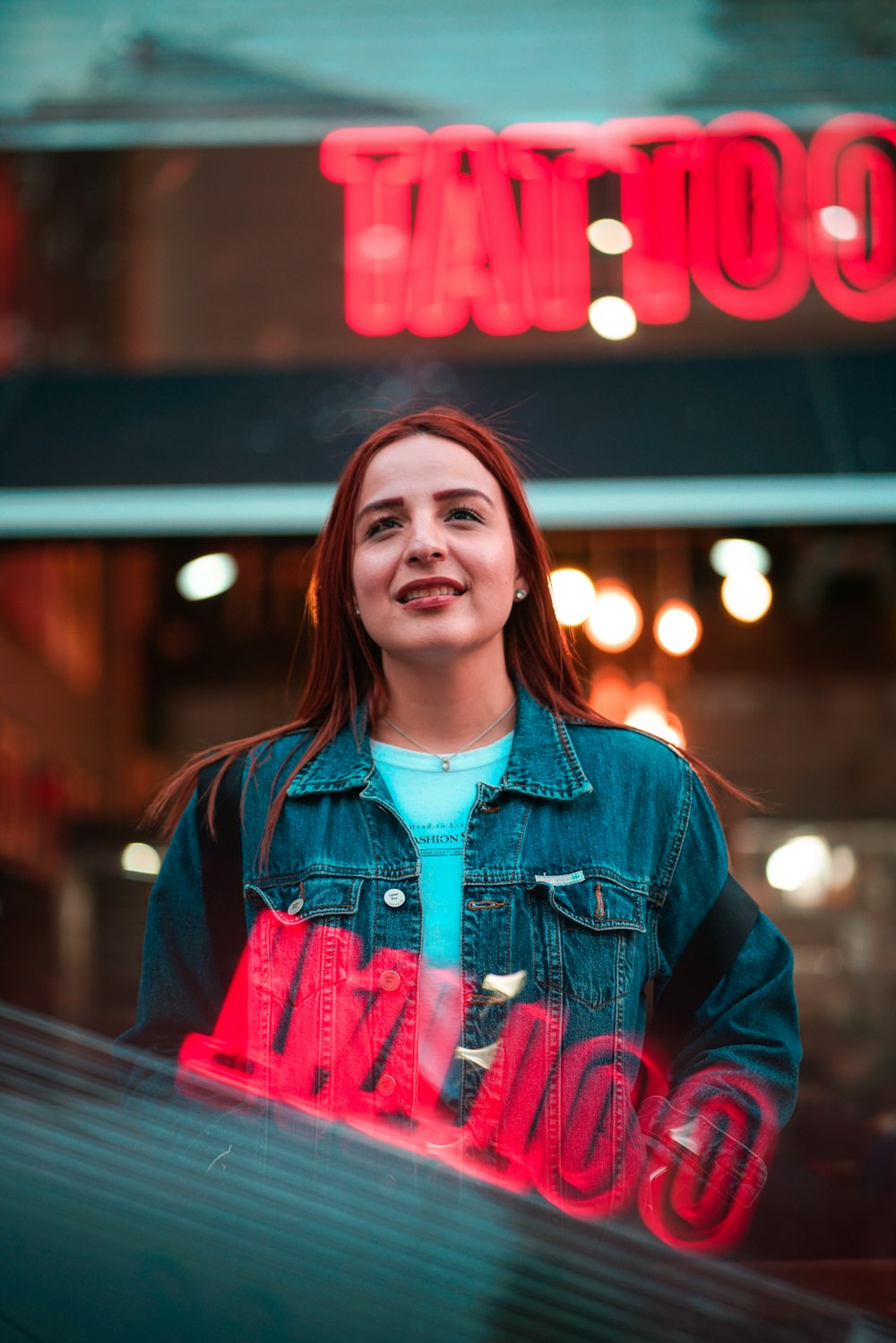 woman in blue denim jacket smiling