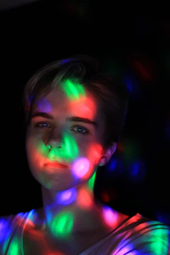 Artist directing a music video with AI-generated visual effects glowing around.