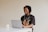 man in black crew neck t-shirt using macbook