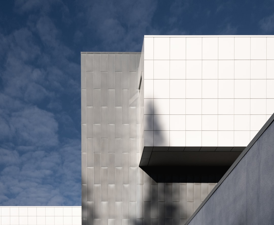 white concrete building under blue sky during daytime