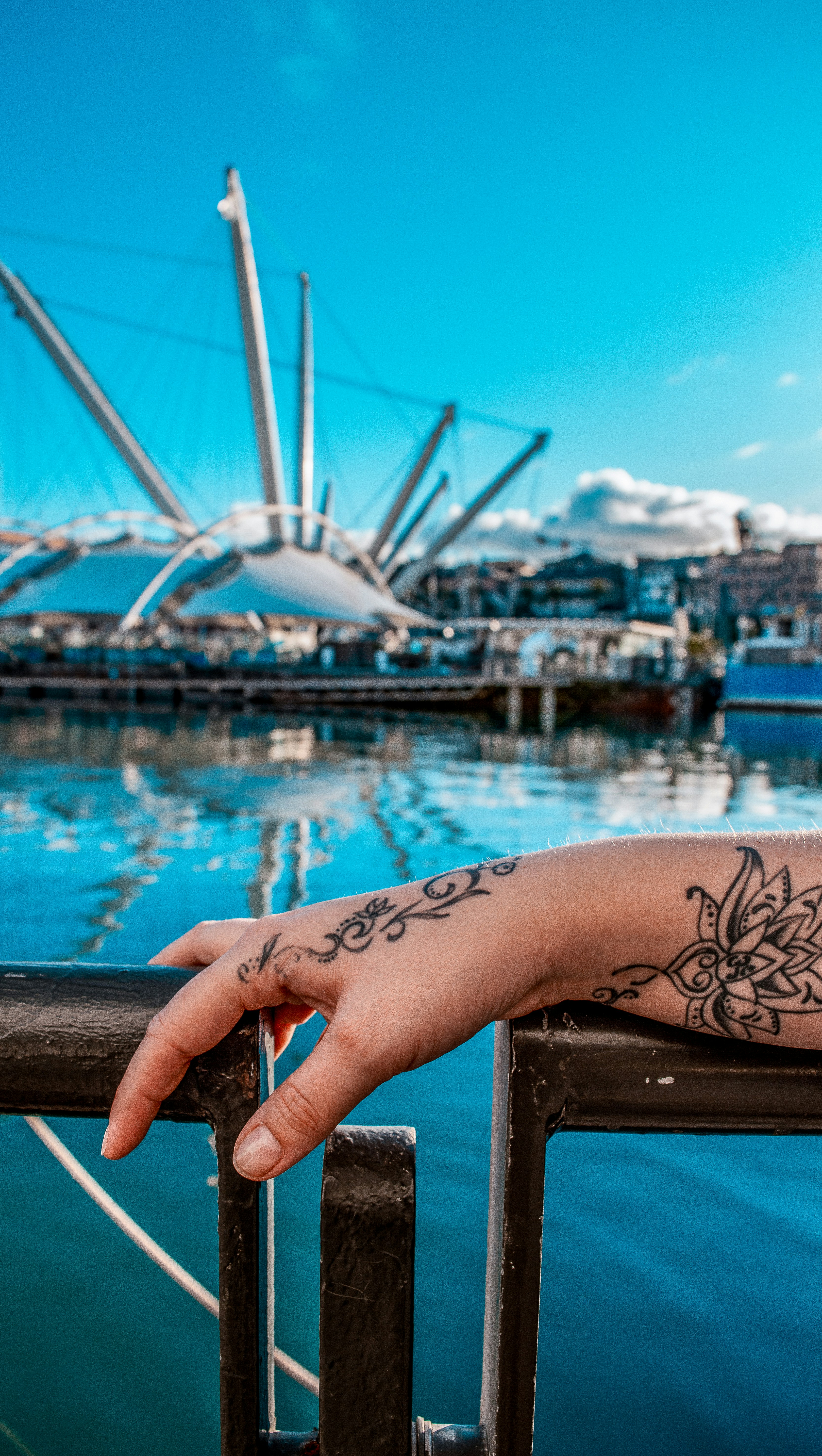 person with black tattoo on left arm