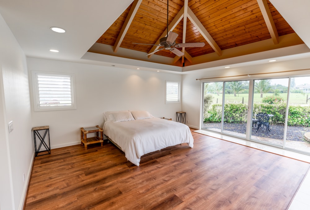 white bed linen on bed