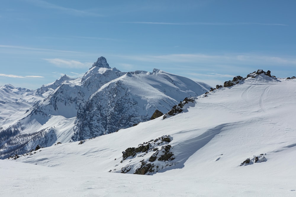 snow covered mountain under blue sky during daytime