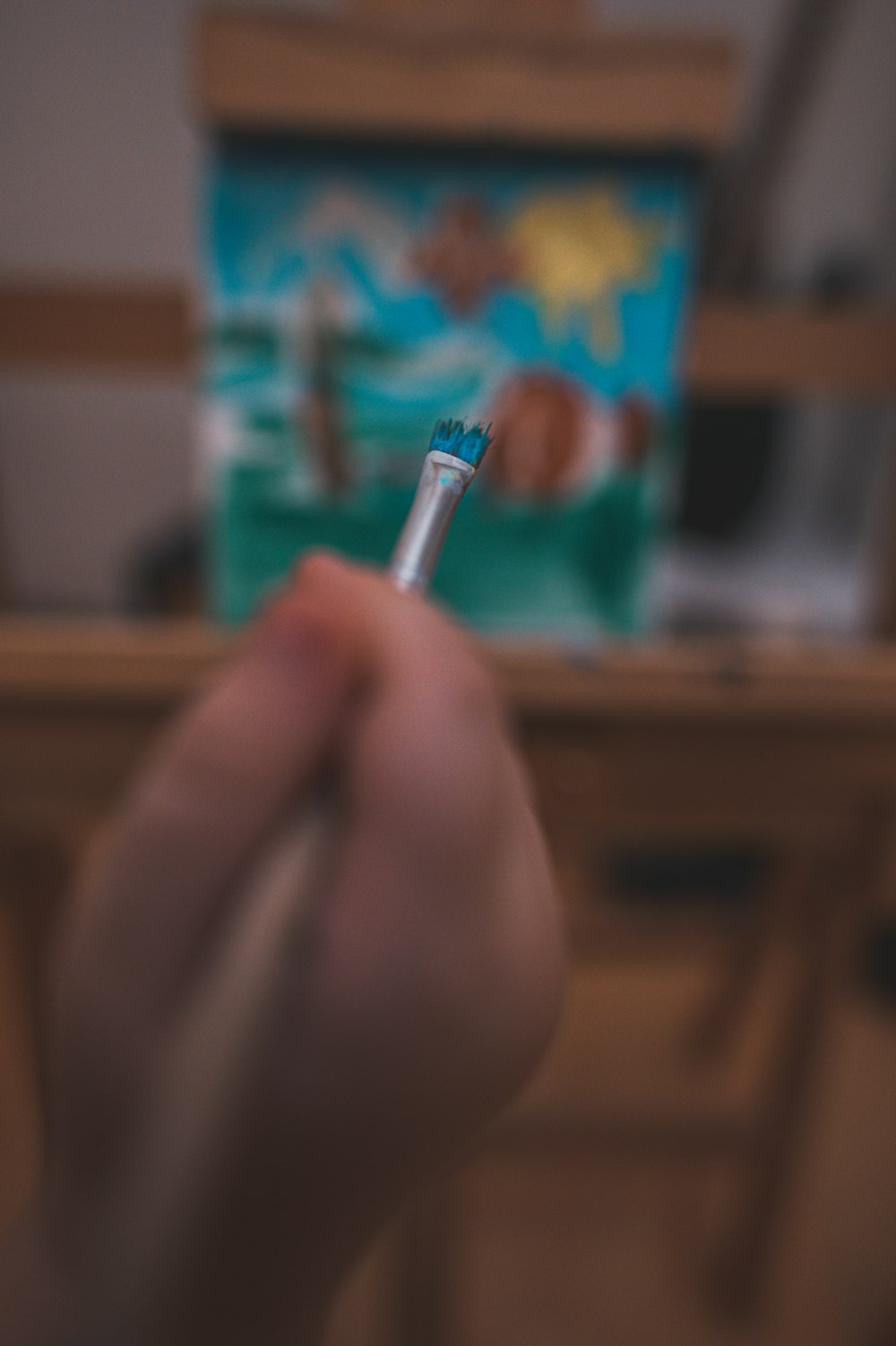 person holding silver and white pen