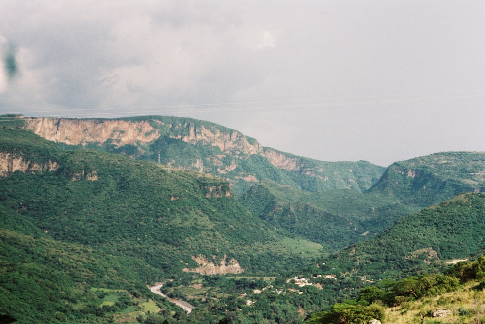 green mountains under white sky during daytime