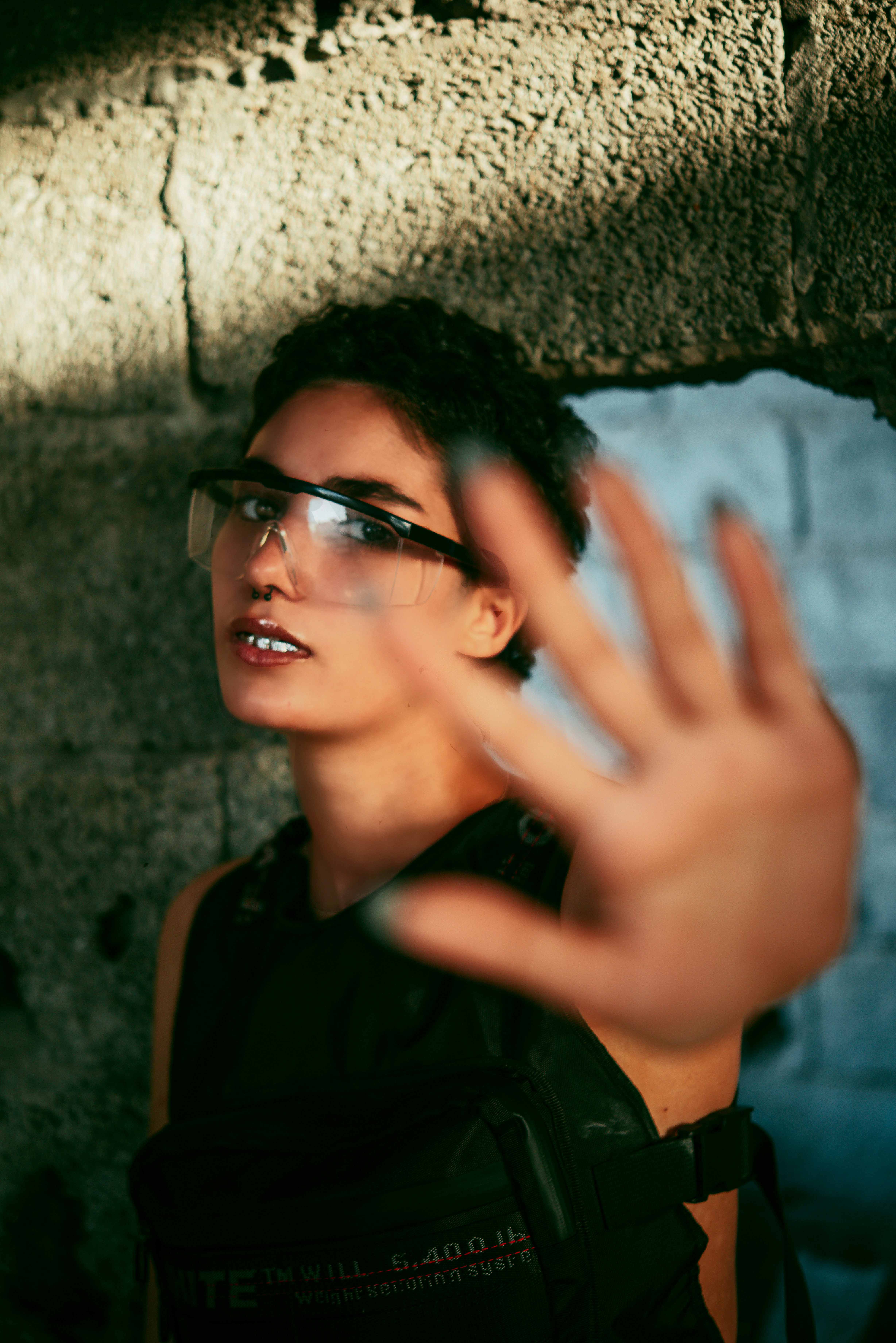 woman in black framed eyeglasses and black jacket