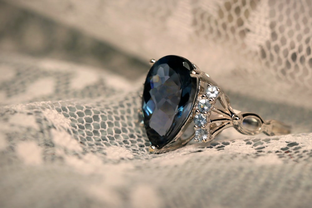 silver and blue gemstone ring